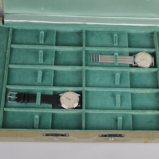 Detail of vintage light green Girard Perregaux watch case.