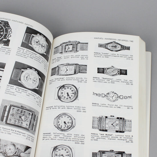 Vintage watch price quide book pages full of wristwatch images