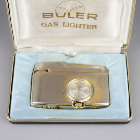 Vintage lighter with Buler watch.