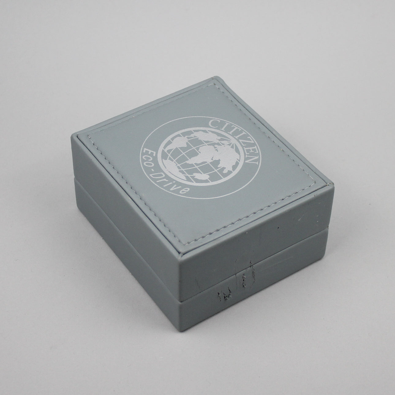 Citizen Eco-Drive light grey watch box.