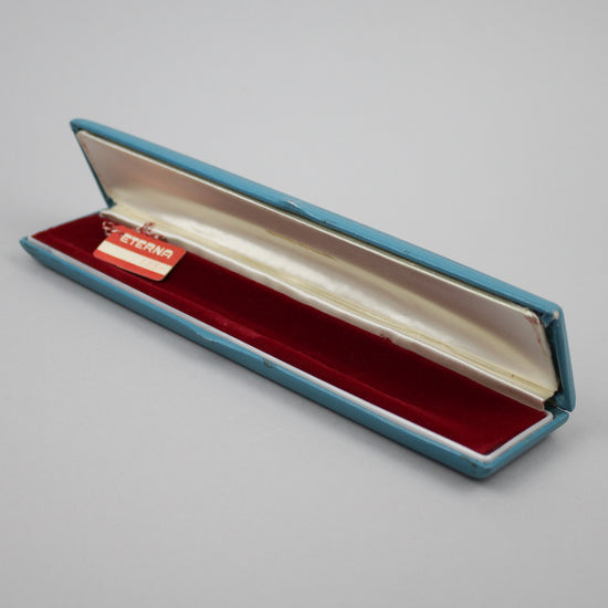 Eterna light blue watch box with hang tag.