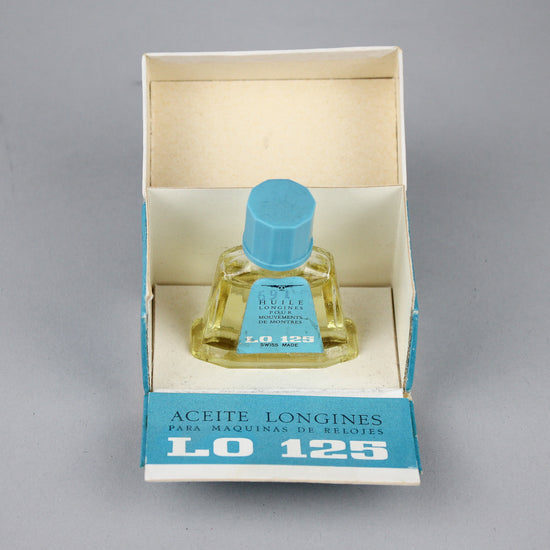 Light blue Longines old watch oil in a nice bottle and box.