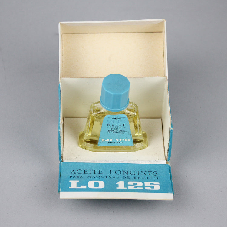 Light blue Longines old watch oil in a nice bottle and box.