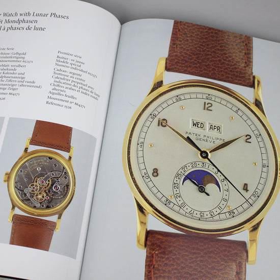 Patek Philippe book pages image of vintage Patek Philippe watch with lunar phases.