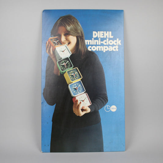 Blue advertisement for colourful Diehl alarm clocks.