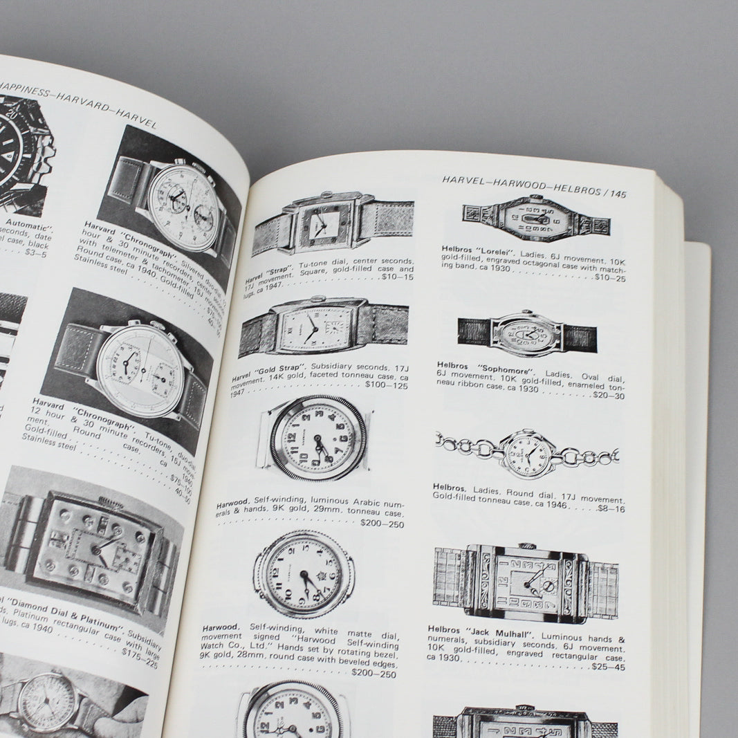 Vintage watch price quide book pages full of wristwatch images