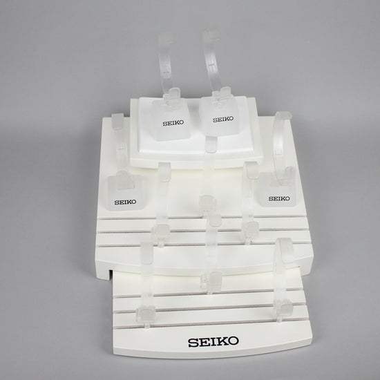 white seiko watch stand front