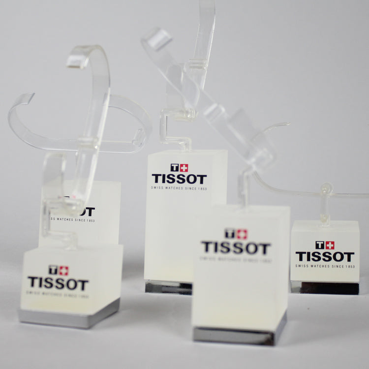 Tissot watch stands close up.