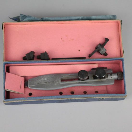 Watch caseback opener tool in the original box.